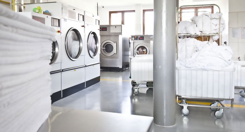 Commercial laundry facility with industrial dryers